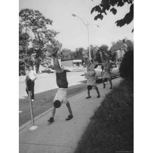 Teenagers Doing Walking on Their Hands Down the Street Photographic 