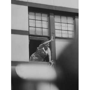  An Adlai E. Stevenson Supporter Waving from Window During 