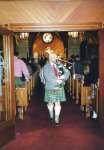 Tom piping at a Kirkin of the Tartan