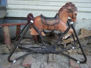   little brown hard plastic springing bouncing rocking horse with wood