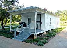   single paned window. The visible side of the house, about 30 feet long