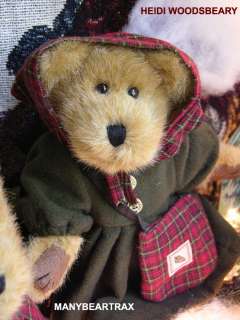 demure head scarf and carries her red plaid shoulder bag