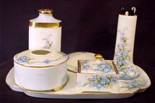 and green foliage on white china with gold gilt trim