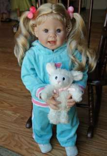   doll with light skin tone blonde hair and blue eyes her straight legs
