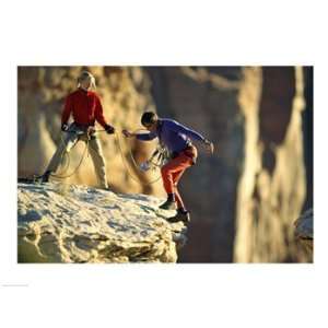  Two hikers with ropes at the edge of a cliff Poster (24.00 