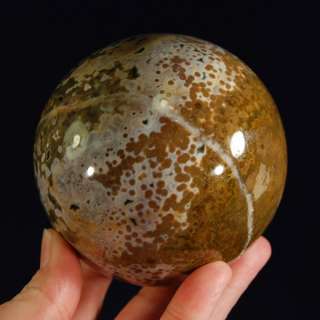 You are considering a beautiful ocean jasper sphere with a hematite 