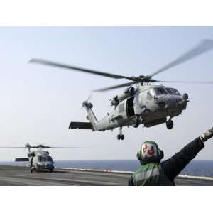  An Hh 60H Sea Hawk Helicopter Takes Off from Uss Ronald 