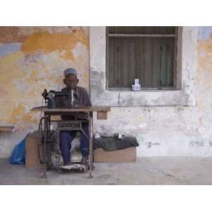  Man Works His Sewing Machine on Ibo Island, Part of the 