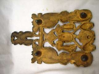 lot of three vintage sad iron trivets. One has a nice Dutch or folk 